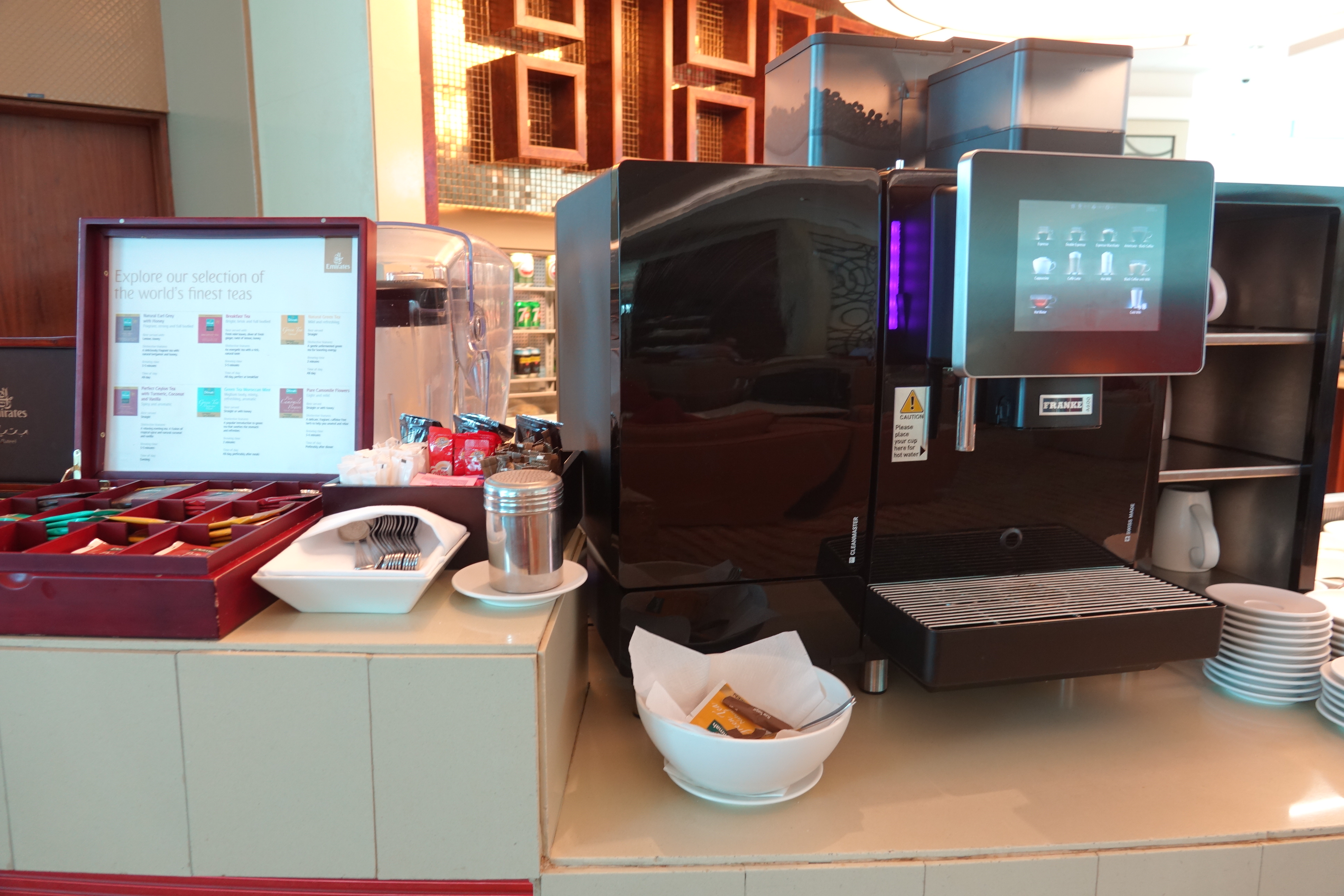 a coffee machine and food on a counter