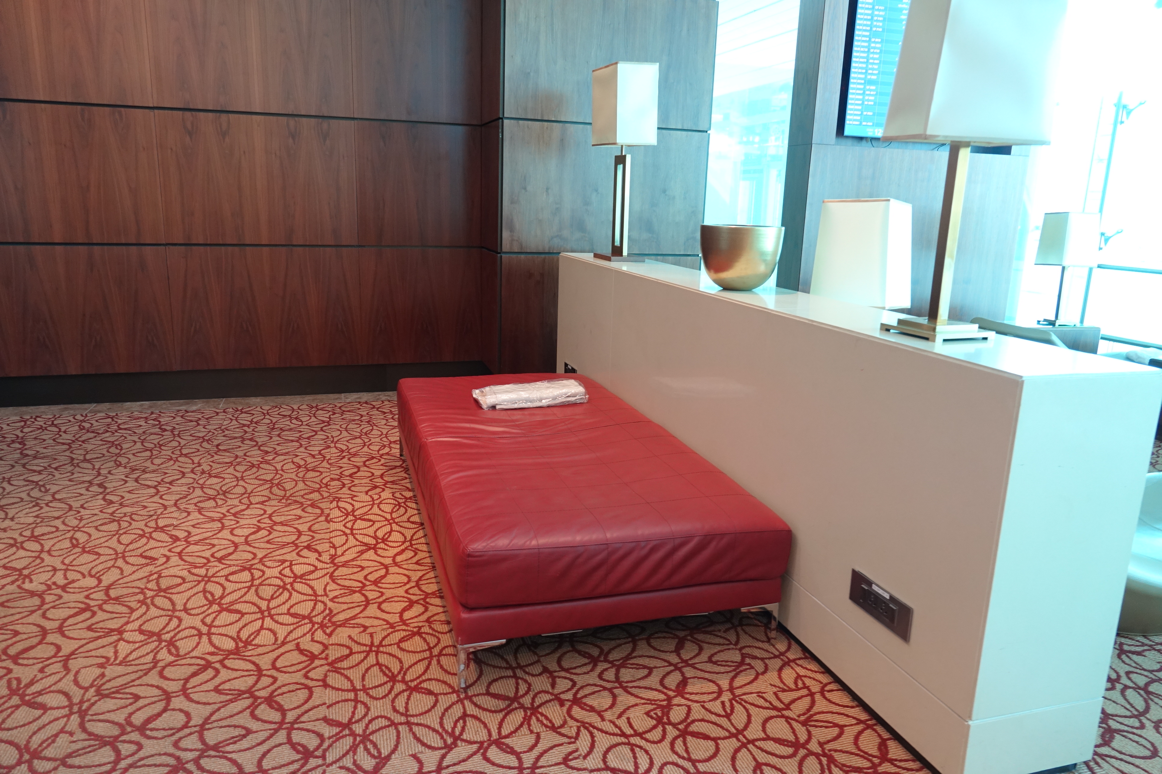 a red ottoman in a room