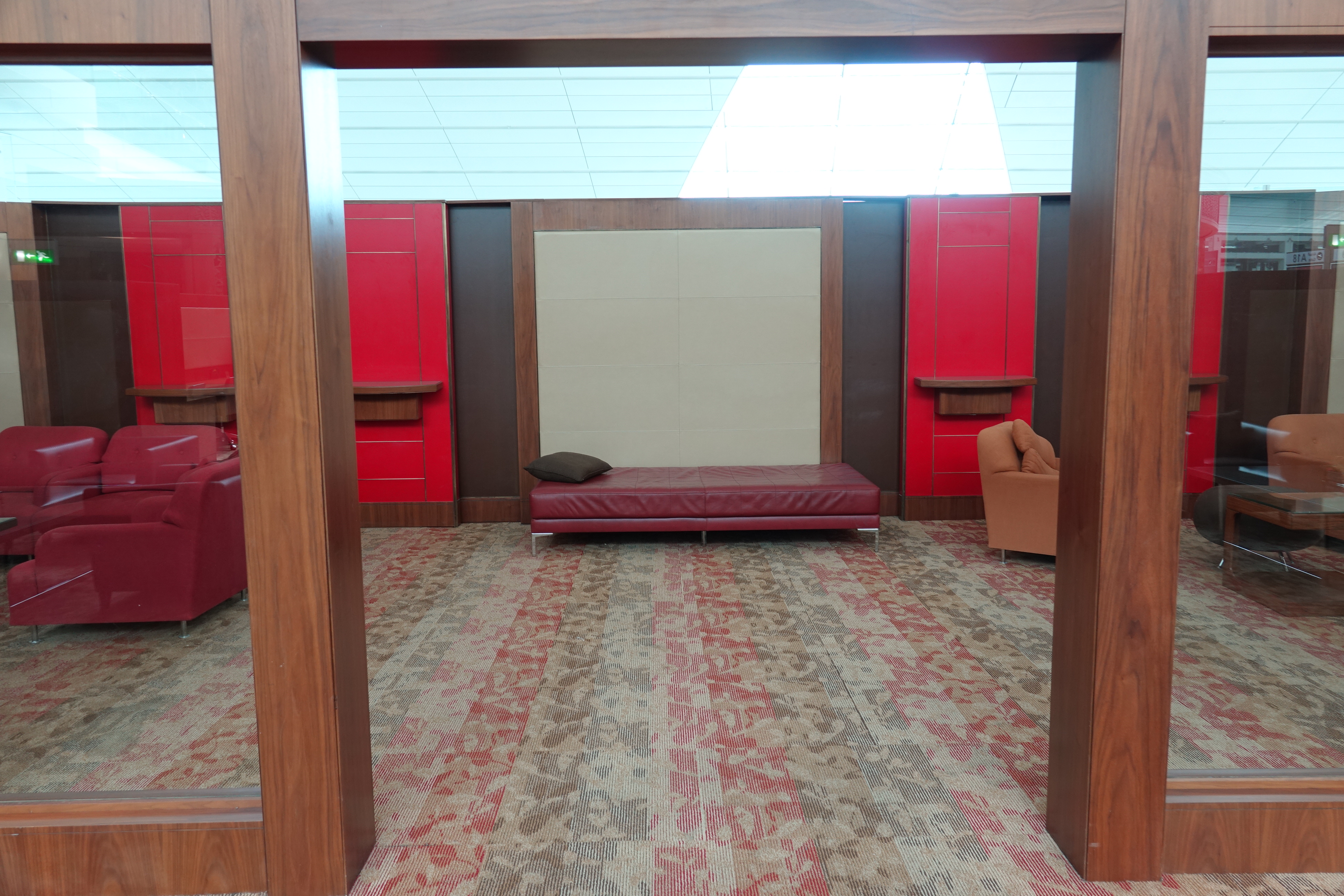 a room with red walls and a couch