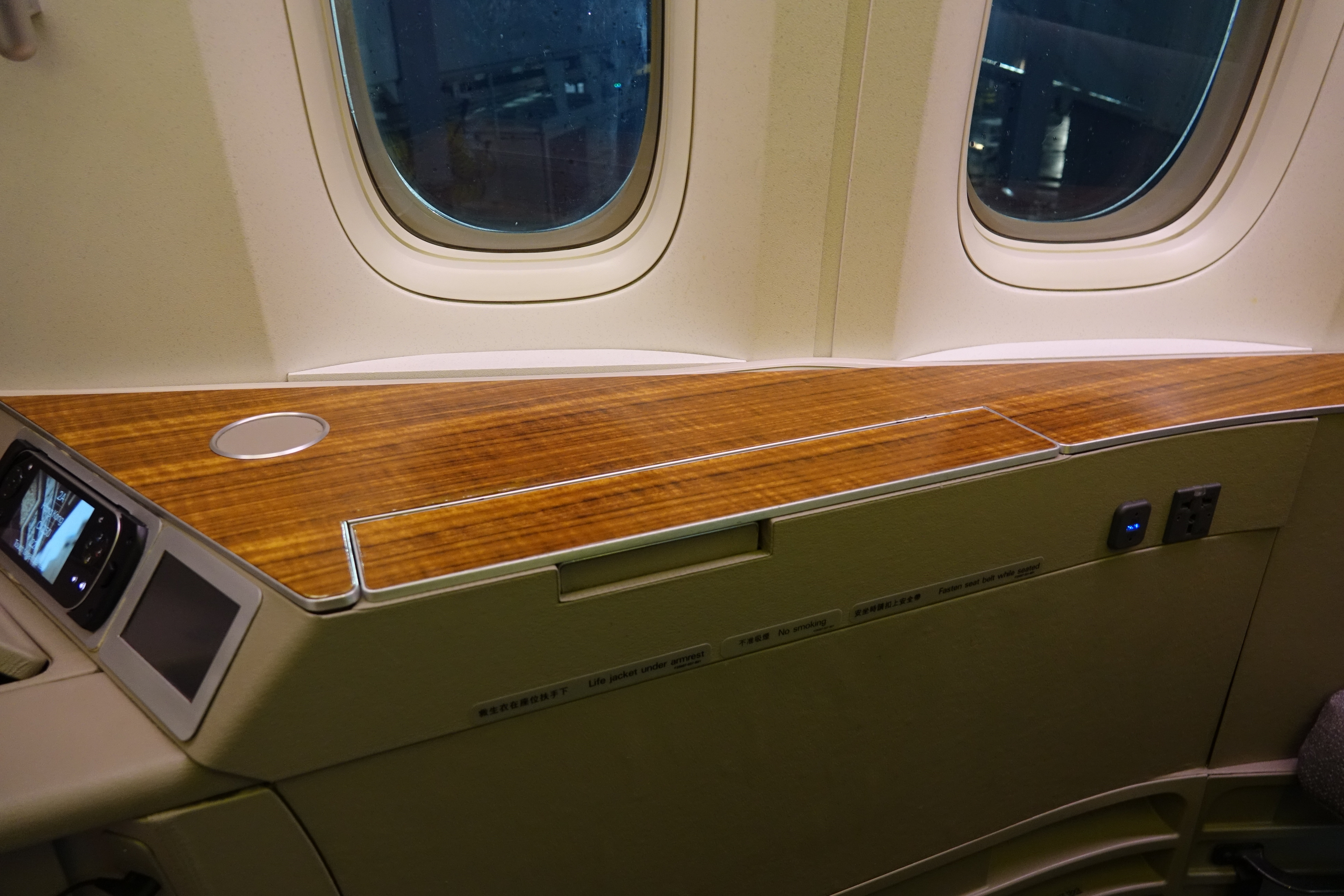 a wooden table in an airplane
