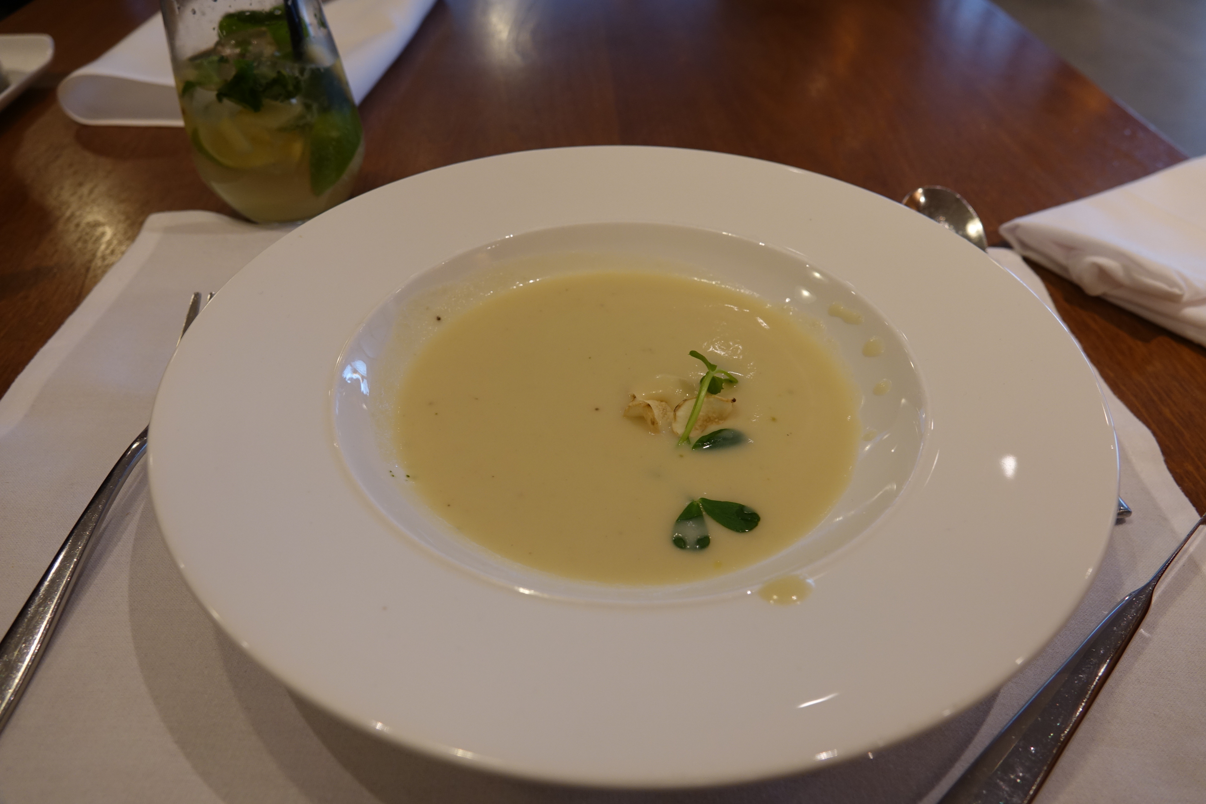a white bowl of soup
