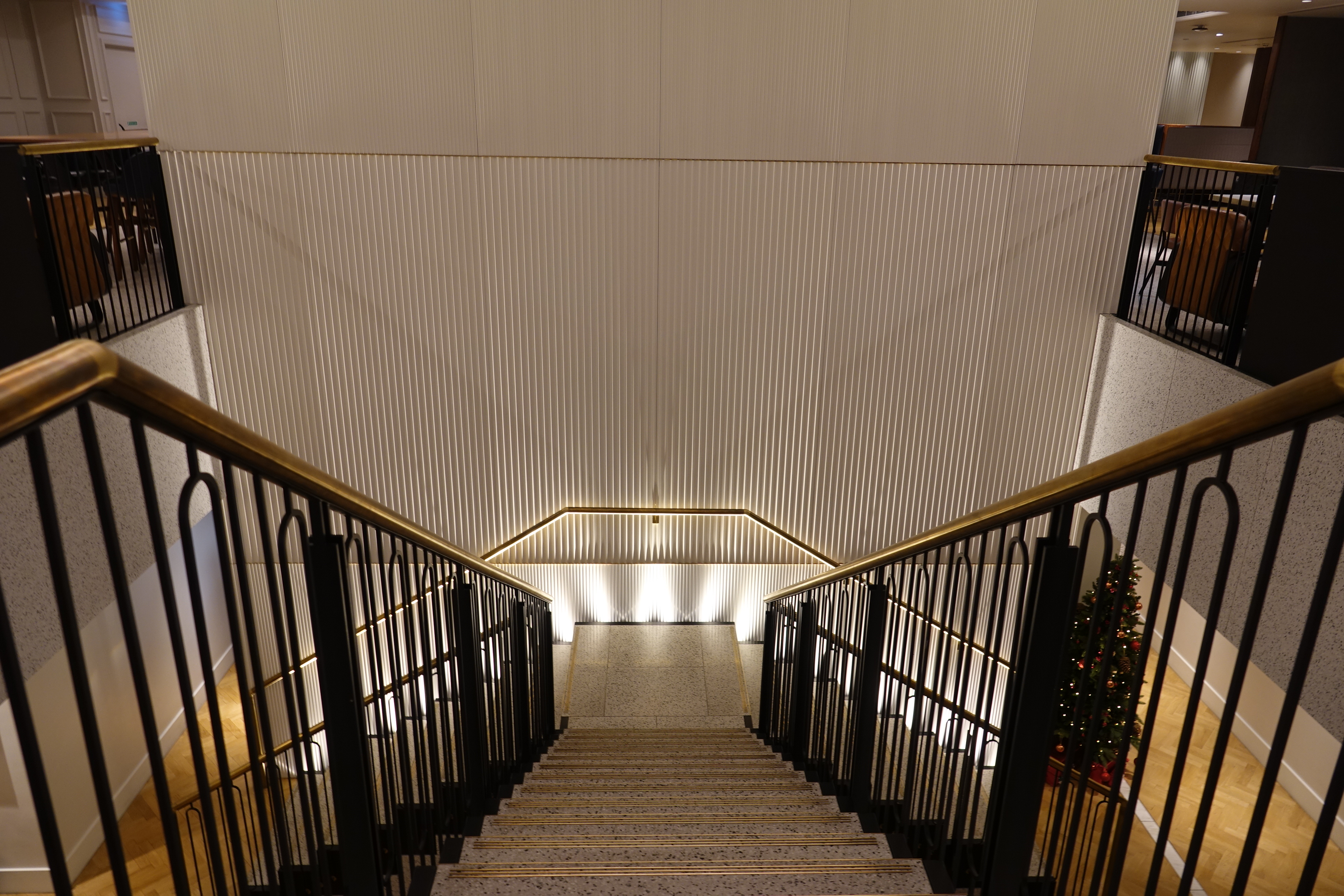 a staircase with a railing and lights