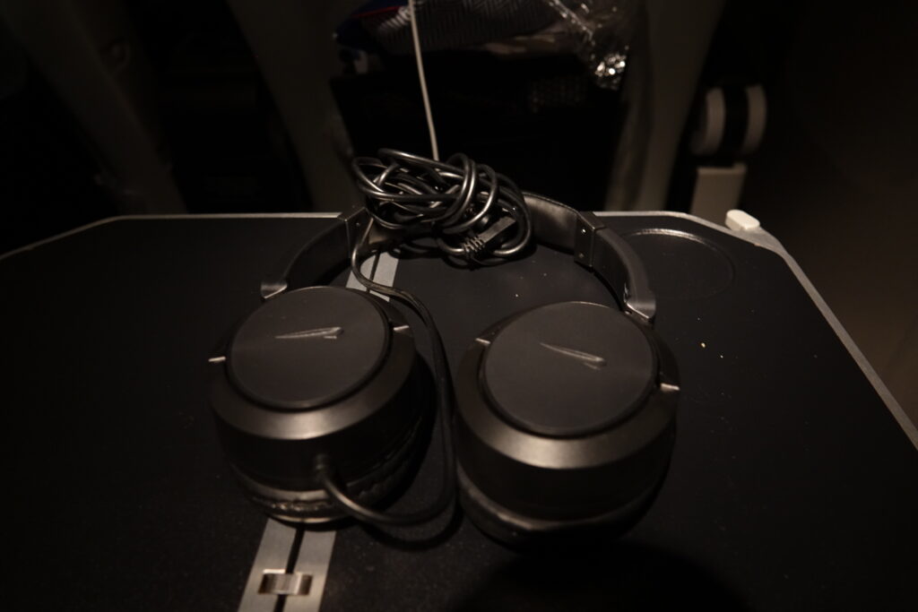 a pair of headphones on a black surface