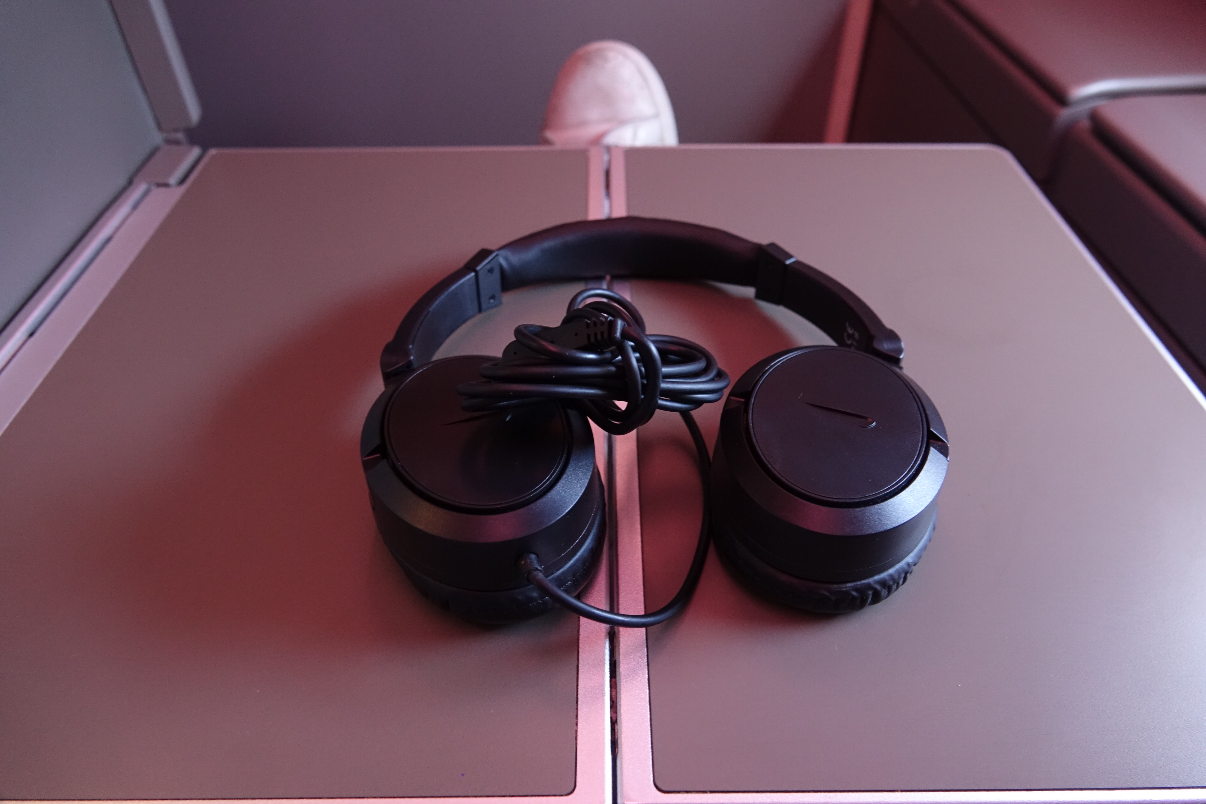 a pair of black headphones on a table