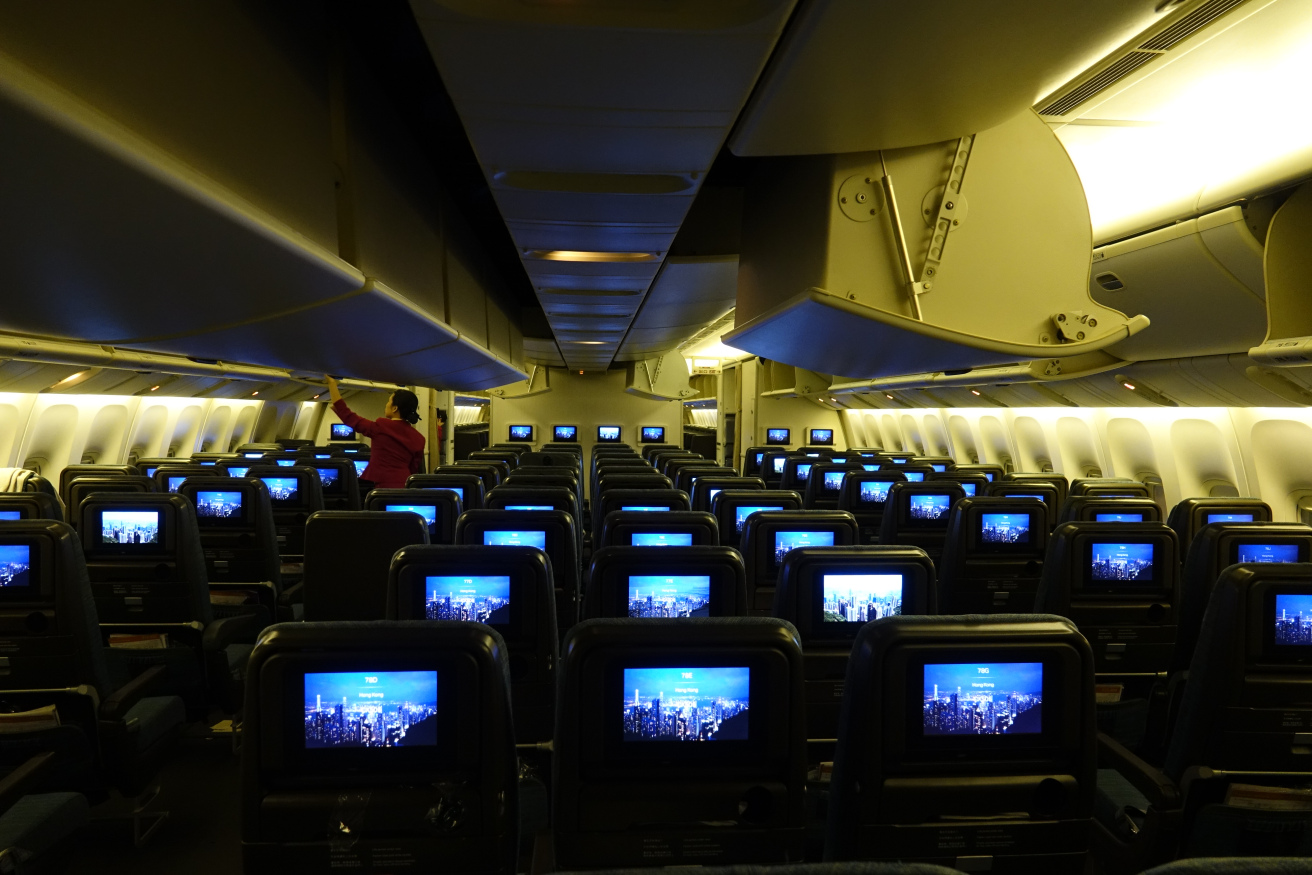 a row of seats with rows of televisions