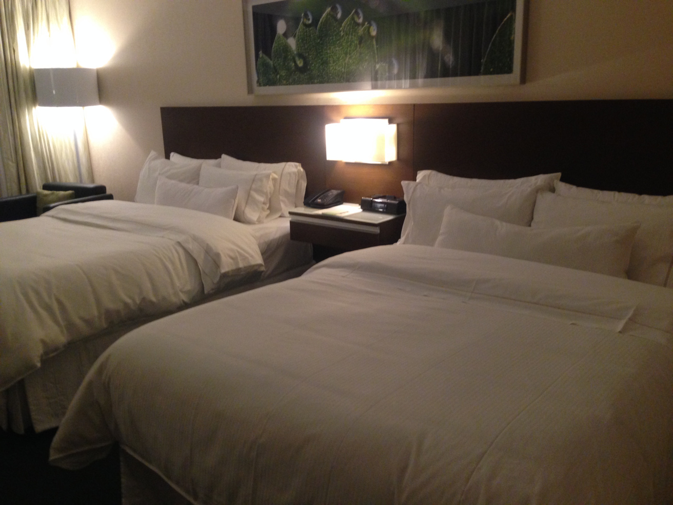 a two beds with white sheets