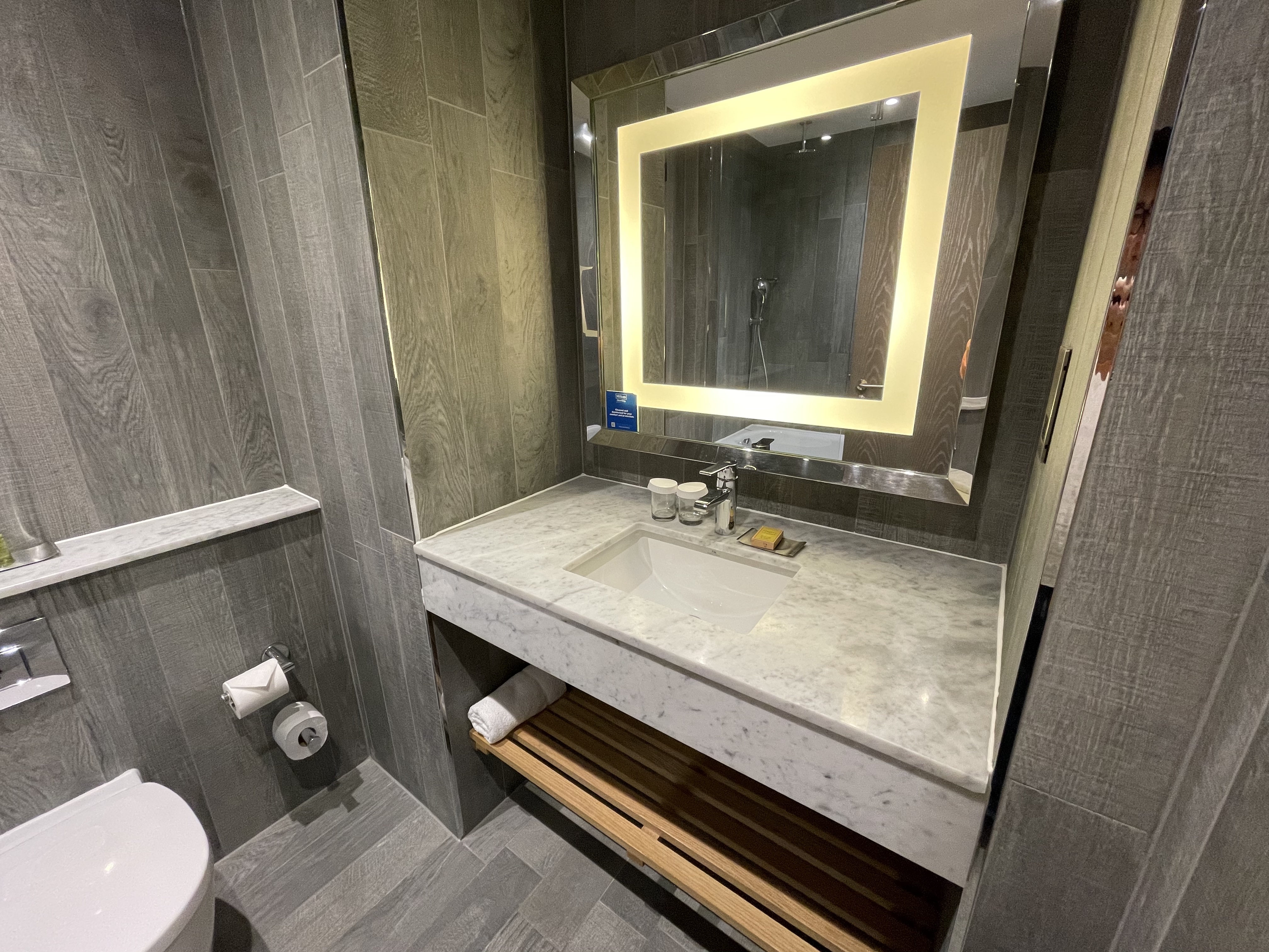 a bathroom with a mirror and a sink