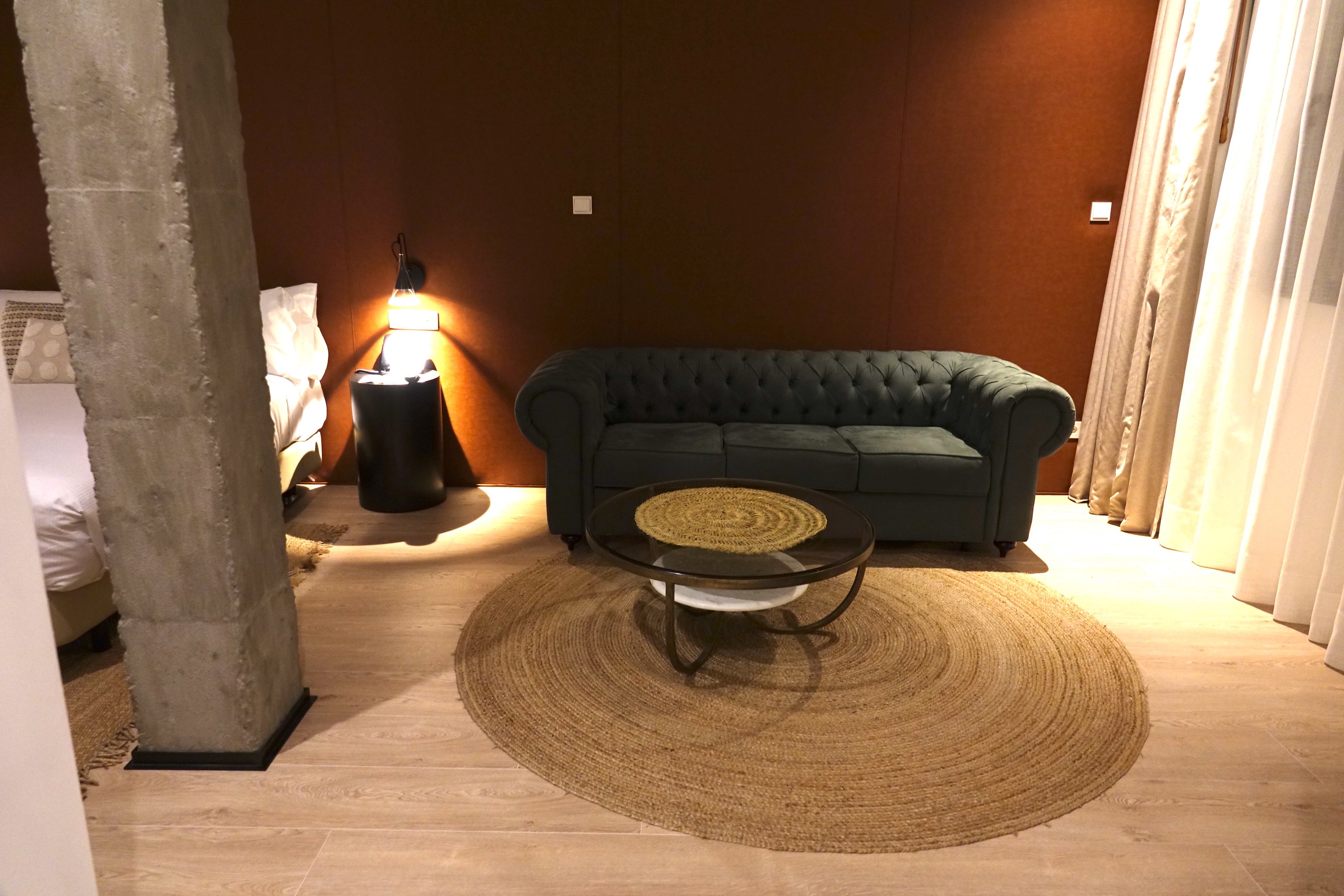 a couch and a round rug in a room