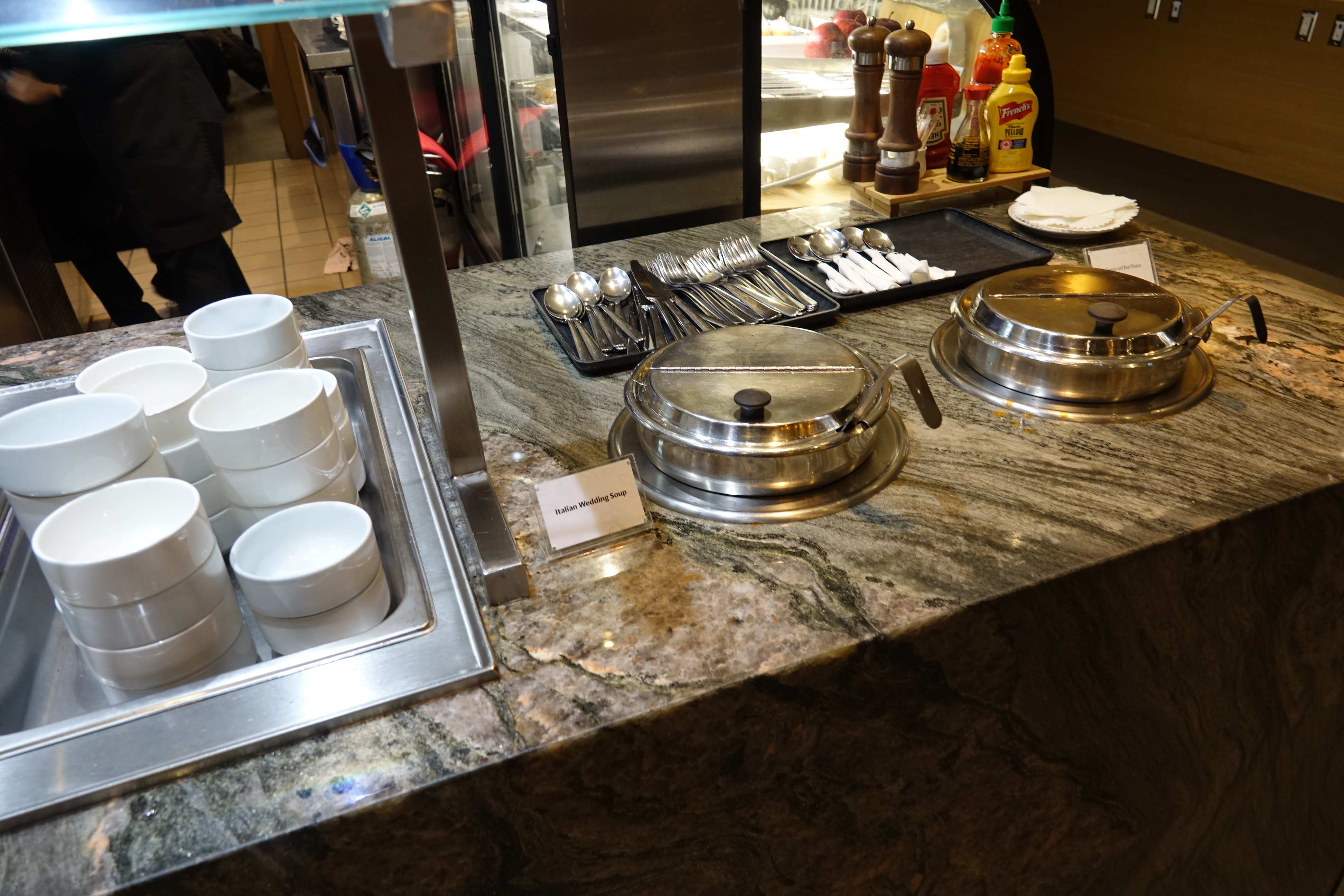 a buffet line with silverware and utensils