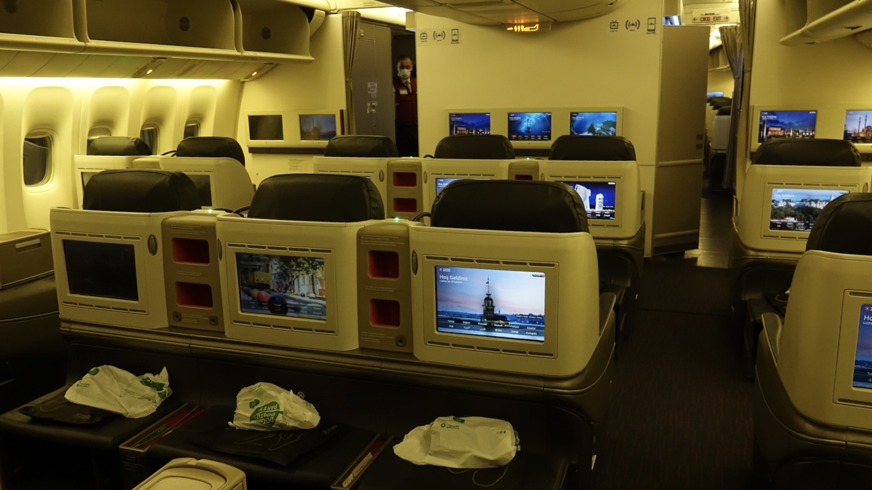 a row of tvs on an airplane
