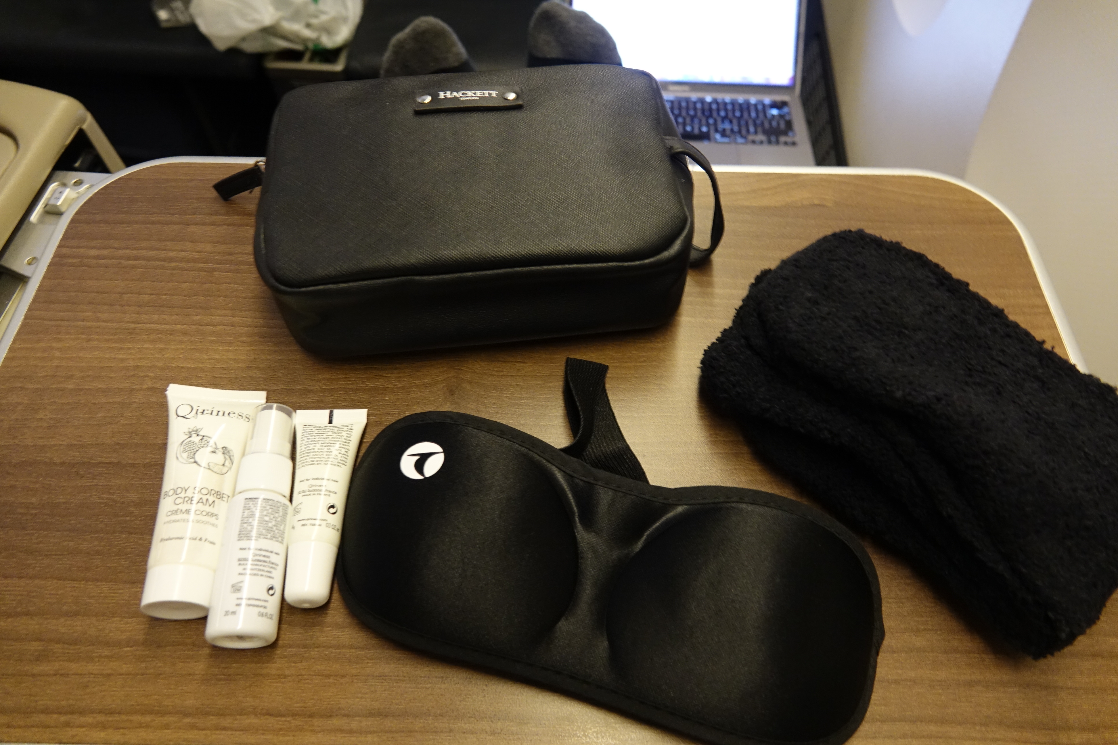 a black bag and a pair of eye masks on a table