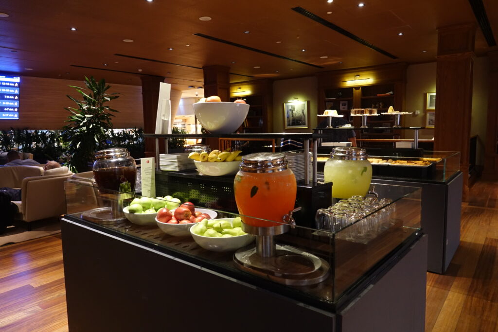 a buffet with fruit and drinks