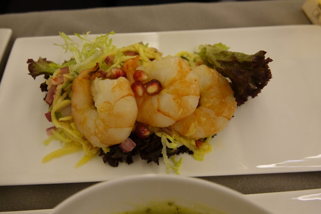 a plate of shrimp and salad