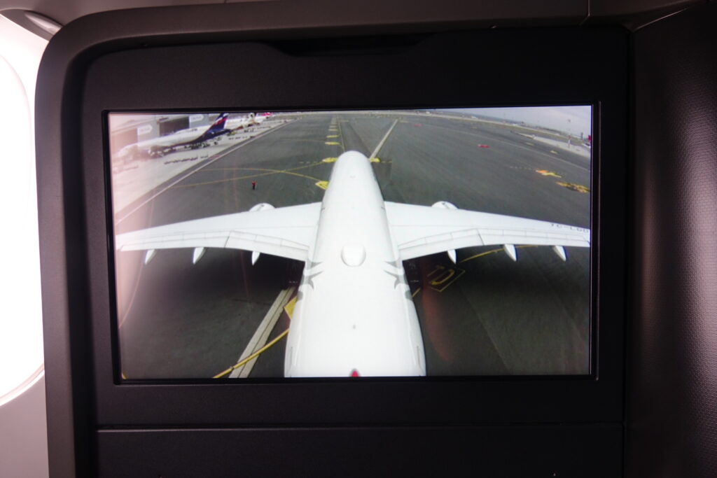 a screen showing an airplane taking off