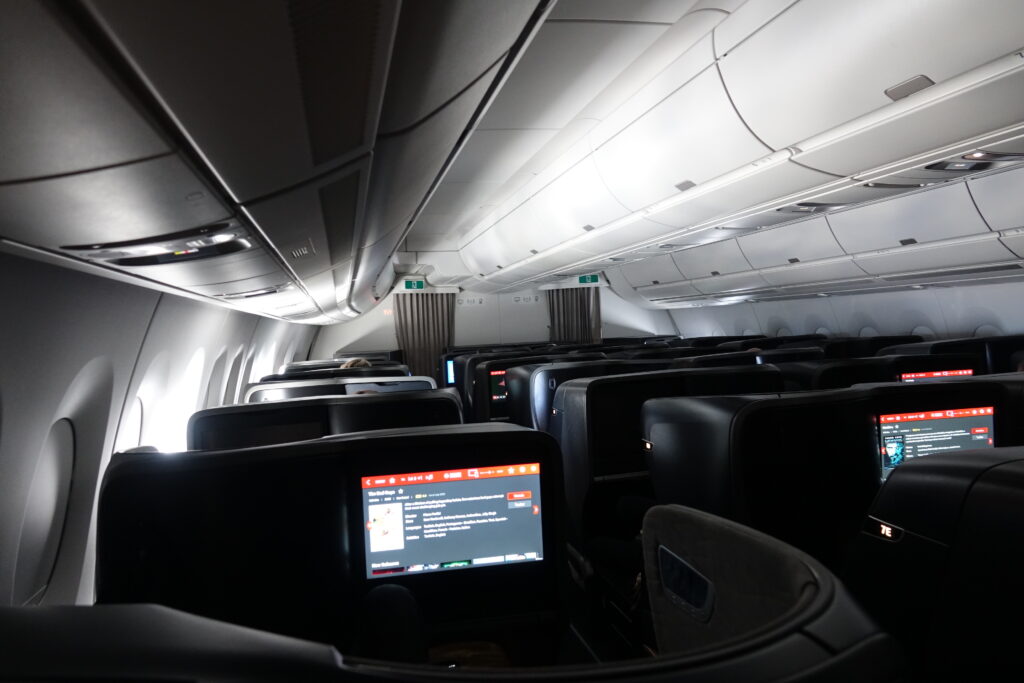 an airplane with seats and a monitor
