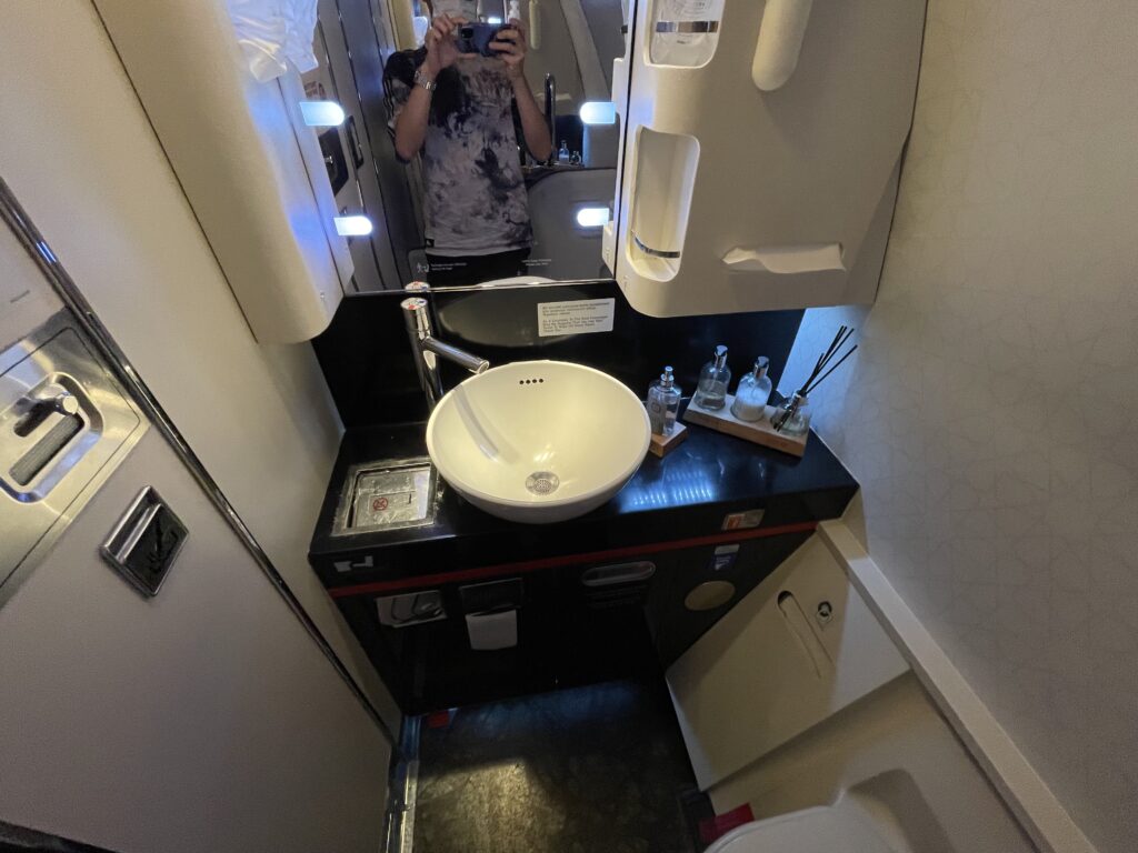 a person taking a selfie in a bathroom