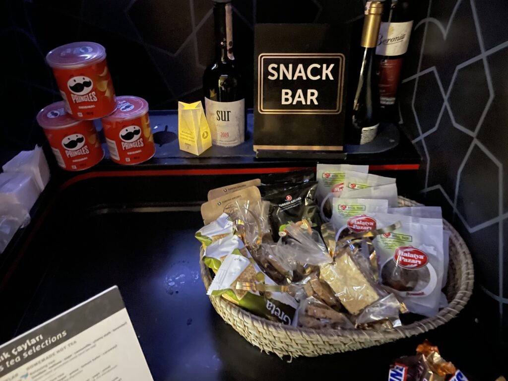 a basket of snacks and drinks on a shelf