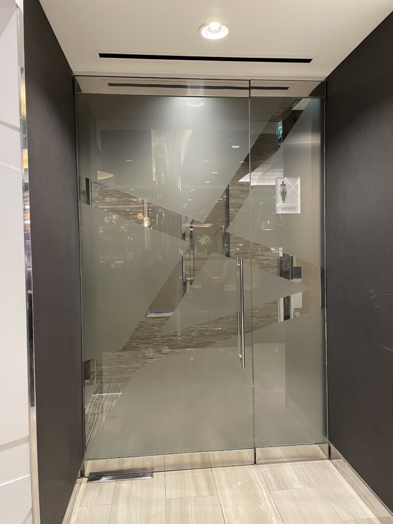 a glass door with a design on it