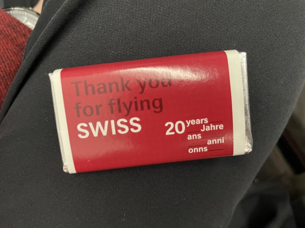a small red package with white text on it