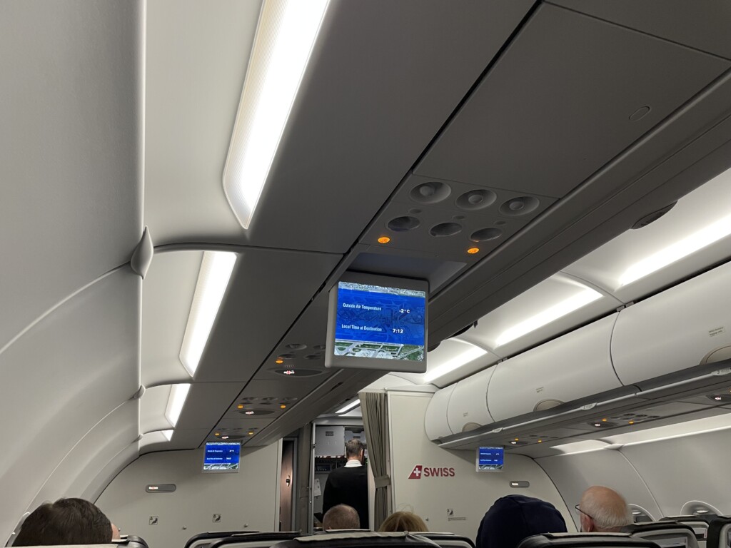 a tv screen on an airplane