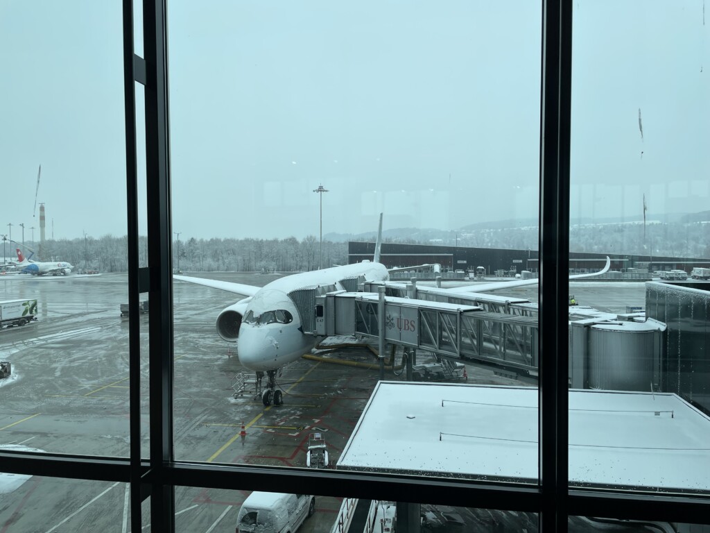 Snow-capped Cathay Pacific A350 at Zurich Airport