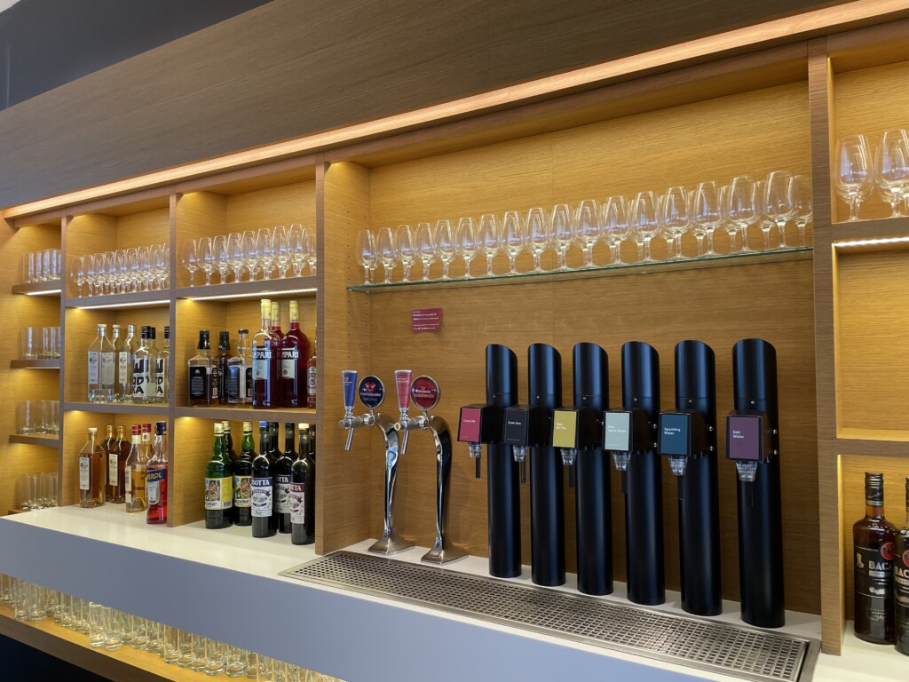 a bar with liquor bottles and glasses
