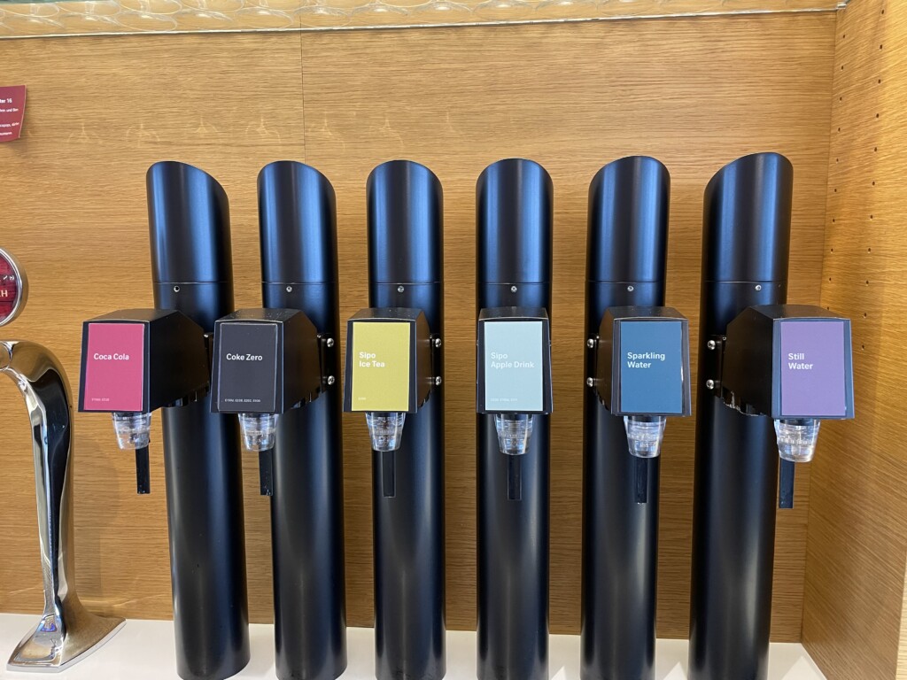 a group of black pipes with different colored labels