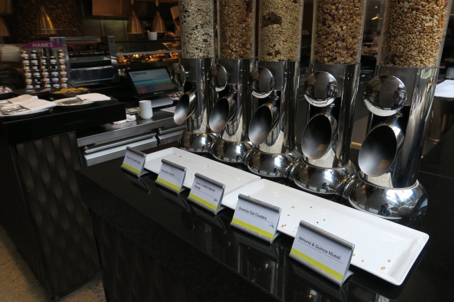 a group of food dispensers on a counter