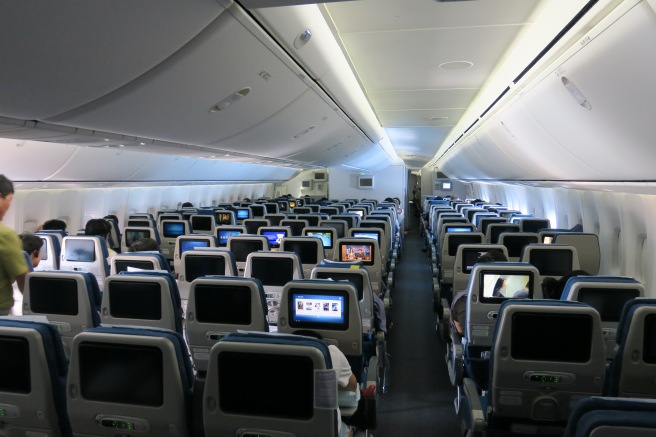 an airplane with many seats and monitors