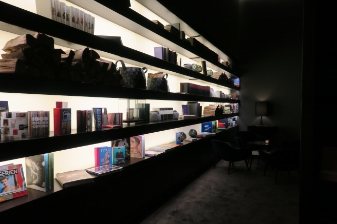 a shelf with books and lights
