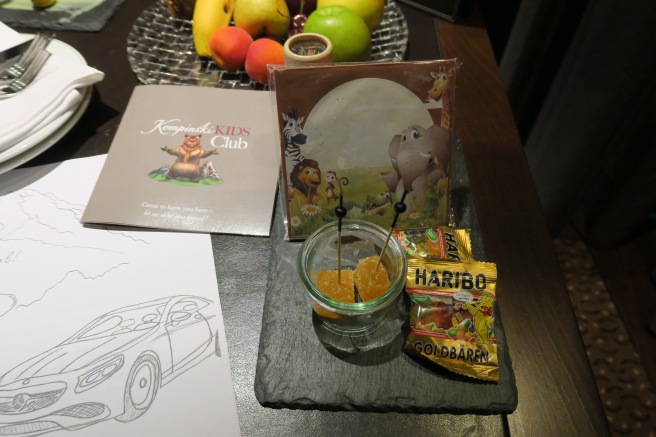 a table with food and a drawing of a car