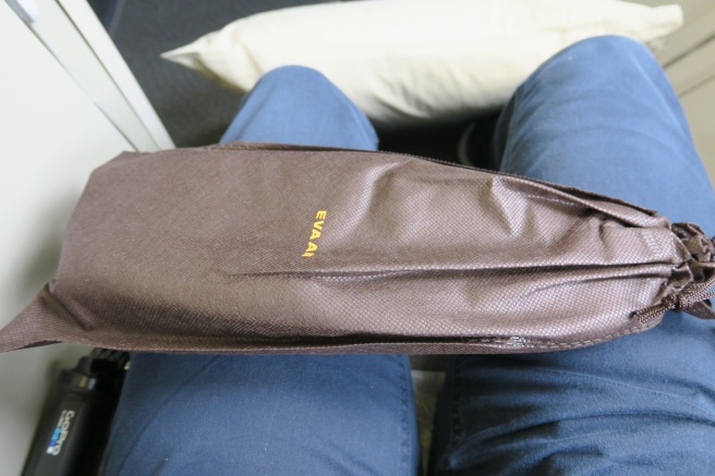 a brown bag on a person's legs