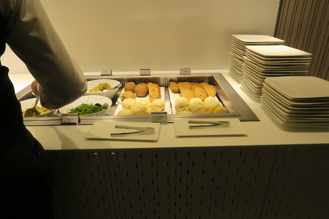 a buffet with plates and food