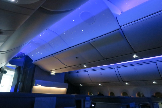 a blue lights on the ceiling of an airplane