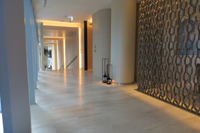 a hallway with a metal screen