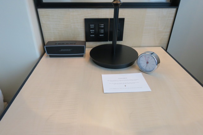 a clock and alarm clock on a table