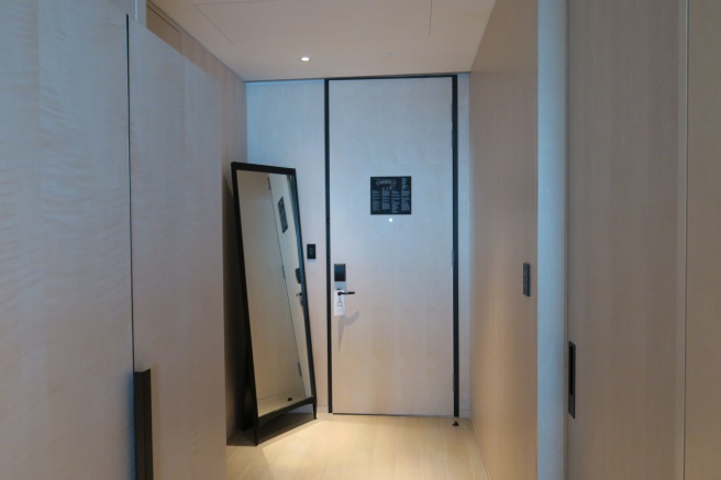 a mirror next to a door
