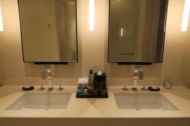 a bathroom with two sinks and mirrors
