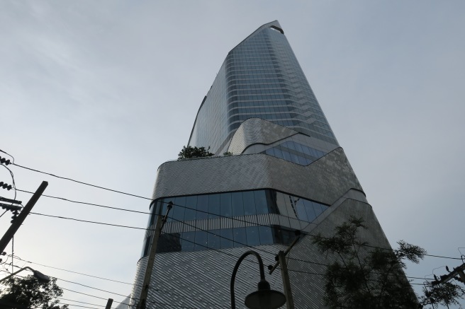 a tall building with a curved roof