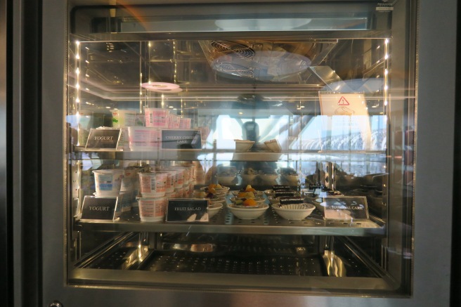 a glass case with food in it
