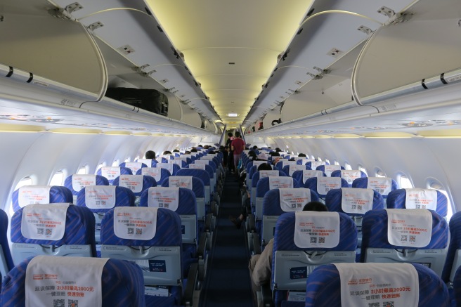 a plane with blue seats and white signs