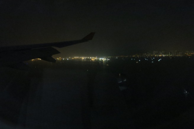 a view of a city from a plane window at night