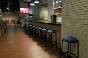 a row of stools in a bar