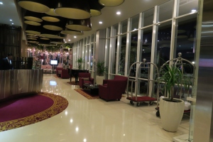a lobby with chairs and a large window