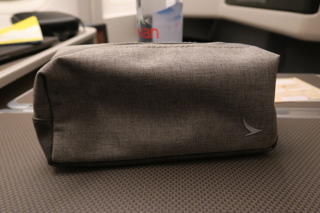 a small grey bag on a table