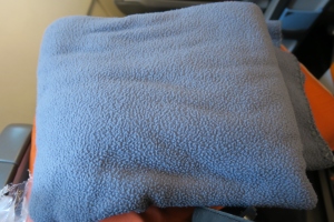 a blue blanket on a person's lap