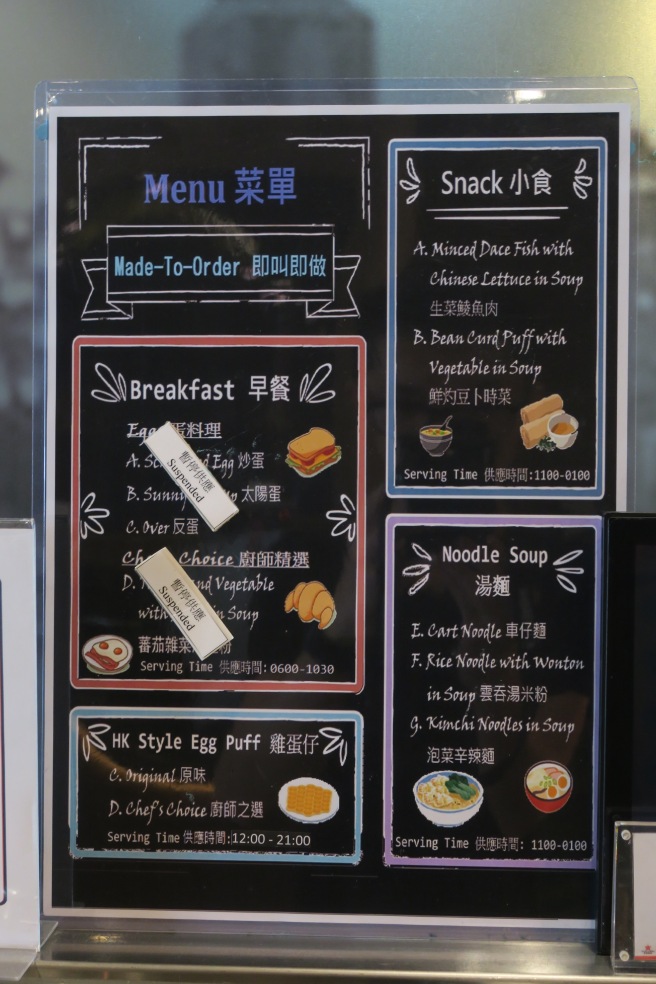 a menu board with different foods on it