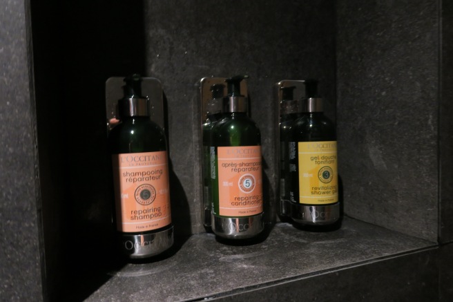 a group of shampoo bottles on a shelf