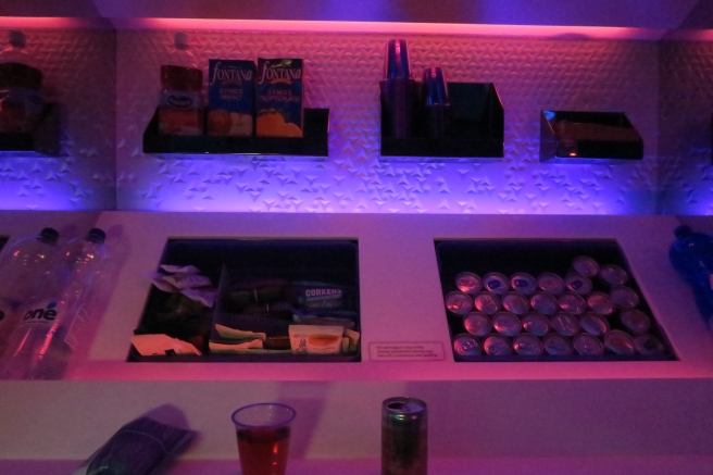 a shelf with drinks and snacks