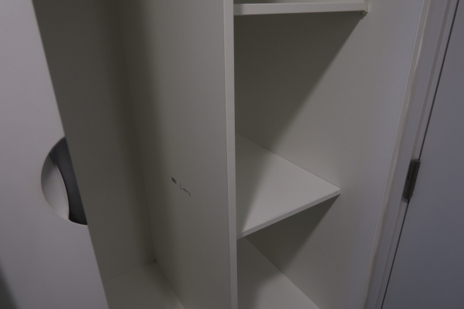 a white shelf in a room